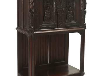 1156
Late 19th/early 20th century
A Continental Gothic-Style Oak Sideboard
The carved oak sideboard with Gothic and medieval-style decoration and wrought iron hardware, featuring a two-door cabinet atop an undershelf
53.5" H x 37" W x 18.5" D
Estimate: $300 - $500