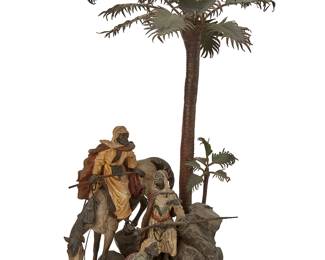 1158
Late 19th/early 20th century; Austria
An Austrian Cold-Painted Bronze Sculpture
Stamped with spurious maker's mark for Bergman; further marked: Geschutzt
The polychromed cast bronze and sheet metal sculpture depicting soldiers, both on horseback and foot, on a rocky outcropping with a tall palm tree towering over the figures
16" H x 7" W x 9.5" D
Estimate: $600 - $800
