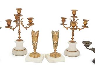 1162
Late 19th/early 20th century
A Group Of Candle Holders
Each appears unmarked
Comprising one pair of gilt bronze four-light candelabrum on alabaster bases, one cast bronze two-light candleholder, and one bronze and ceramic two-light candleholder on a marble base; along with a pair of gilt bronze and marble garniture, 6 pieces
Largest: 12" H x 7" Dia.; smallest: 7.25" H x 4" W x 4" D
Estimate: $300 - $500