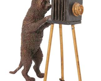 1161
20th century; Austria
A Cold-Painted Vienna Bronze Cat Photographer Sculpture
Appears unmarked
The tabletop sculpture of a cat positioned behind a Daguerreotype camera
8" H x 2" W x 5.25" D
Estimate: $300 - $500