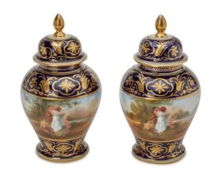 1165
Late 19th century
A Pair Of Royal Vienna Porcelain Vases
Each marked with blue underglaze Bindenschild
Each glazed porcelain lidded vase with a scene of Classical figures in a landscape against a cobalt blue ground, 2 pieces
Each: 8.5" H x 4.5" Dia.
Estimate: $500 - $700