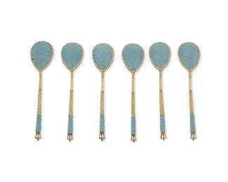 1173
1895-1917; Moscow, Russia
A Set Of Vasily Agafonov Vermeil And Enamel Spoons
Marked for 84 zolotniki silver; further marked: BA
The gilt-silver and light blue champlevé enameled spoons with twisted handle design and scroll motifs, accompanied by original box, 7 items
Each: 3.975" L; box: 1.325" H x 1.325" W x 6.325" D
Estimate: $300 - $500