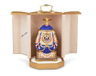 1172
2000
A Fabergé 200th Anniversary White House Egg
Marked to underside: The White House 200th Anniversary / Theo Fabergé / 51/325 / Bronn Fine Porcelain Made in U.S.A.; further signed to case interior: Theo Fabergé
This polychrome enameled porcelain egg was crafted to commemorate the 200th anniversary of the White House and features portraits of John and Abigail Adams and a sterling silver vermeil eagle, revealing a removable sterling silver vermeil White House, housed in a gold-toned handled case
Egg: 8.25" H x 4.325" W x 3.5" D; case: 10.5" H x 6.5" W x 6.5" D
Estimate: $700 - $900