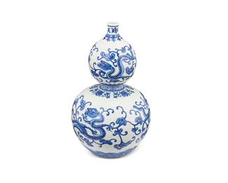 1184
20th century
A Chinese Blue And White Double-Gourd Porcelain Vase
Marked to the underside in blue underglaze bearing an apocryphal reign mark for Qianlong Period (1736-1795)
With an all-over dragon and stylized ruyi fungus motifs to the body and wave motif banding at the foot
9.5" H x 5" Dia.
Estimate: $300 - $500