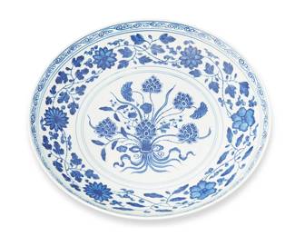 1186
20th century
A Chinese Blue And White Porcelain Dish
Marked to the underside in blue underglaze bearing an apocryphal reign mark for Yongzheng Period (1723-1735)
Decorated with repeating vine and lotus scroll motifs surrounding a central floral medallion in blue underglaze on a white glazed ground
2" H x 10.25" Dia.
Estimate: $300 - $500