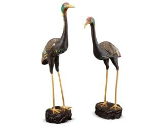 1198
Mid-20th century
A Pair Of Chinese Brass And Cloisonné Cranes
Each appears unmarked
Each mounted to a carved and lacquered wood base with stylized wave motifs
Each: 25.25" H x 6" W x 4.25" D approximately
Estimate: $500 - $700