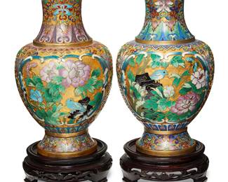 1197
Late 20th century
A Pair Of Chinese Cloisonné Vases
Each with sticker to side: Made in China
Each gilt-brass vase with polychrome floral and avian decoration on a carved wood stand, 2 pieces
Each overall: 11.625" H x 5.25" Dia.
Estimate: $100 - $200
