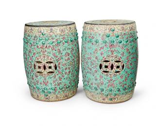 1207
20th century
A Pair Of Chinese Famille Verte-Style Porcelain Garden Stools
Each appears unmarked
The glazed ceramic stools with all-over floral and foliate motifs on pale green ground centering a floral medallion, with pierced accents to the top and sides and low-relief bumps near the foot and rim, 2 pieces
Each: 18" H x 14" Dia.
Estimate: $600 - $900