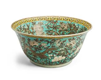 1209
20th century
A Large Chinese Porcelain Fishbowl
Marked to the underside in red enamel bearing an apocryphal reign mark for Qianlong Period (1736-1795)
The interior and exterior decorated with all-over enameling depicting grisaille dragon and floral motifs on a turquoise ground
10" H x 20.5" Dia.
Estimate: $200 - $300