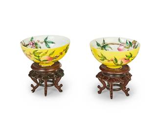 1212
20th century
A Pair Of Chinese Porcelain Peach Bowls
Each marked to the underside in blue underglaze bearing an apocryphal reign mark for Yongzheng Period (1723-1735)
Each with all-over enameling depicting blooming peach branches on a yellow ground on the exterior and white ground on the exterior; each set upon a carved wood stand, 4 pieces
Each with stand: 2" H x 4.25" Dia.
Estimate: $300 - $500