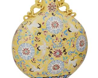 1210
Late 20th century
A Chinese Enameled Porcelain Moon Flask
Appears unmarked
With applied mythical beast form handles to the neck and all-over polychrome enameled lotus scroll motifs on a yellow enameled ground
16.25" H x 12" W x 5.5" D
Estimate: $200 - $300