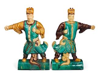 1216
20th century
A Pair Of Chinese Figural Roof Tiles
Each appear unmarked
The green and brown glazed ceramic roof tiles, each depicting a male figure standing in combat stance atop a semi-circular tile, 2 pieces
Each: 17" H x 12.25" W x 5.125" D
Estimate: $300 - $500