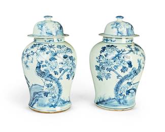 1219
20th century
A Pair Of Chinese Kangxi-Style Porcelain Jars
Each appears unmarked
Each lidded ceramic vessel with blue underglaze decoration of a pheasant perched in a fruit tree on a white ground, 2 pieces
Each: 17.5" H x 10" Dia.
Estimate: $400 - $600