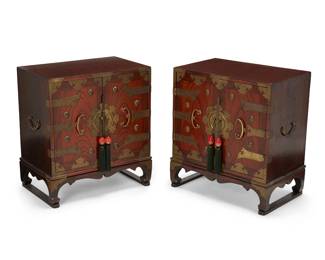 1232
Early 20th century
A Pair Of Korean Side Cabinets
The hardwood cabinets with brass hardware, each featuring two hinged doors accented with hanging tassels with mounted red hardstones, revealing an open cavity above two small drawers, set on four legs joined by two stretchers at the base, 2 pieces
Each: 23.75" H x 21.25" W x 13.5" D
Estimate: $600 - $800