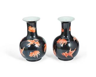1238
Late 20th century
A Pair Of Chinese Goldfish Motif Porcelain Vases
Marked to underside in red enamel: Huaguang Tang Zhi
The globular vase with attenuated and flared neck featuring goldfish on a black ground, 2 pieces
Each: 9" H x 5.5" Dia.
Estimate: $200 - $300
