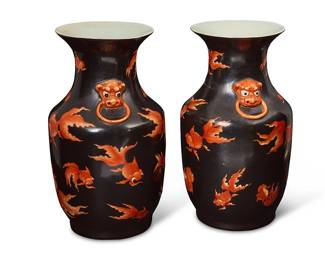 1239
20th century
A Pair Of Chinese Goldfish Motif Porcelain Vases
Each marked to the underside in red enamel bearing an apocryphal reign mark for Jiaqing Period (1796-1820)
Each ceramic vessel with all-over decoration depicting orange goldfish on a matte black ground and opposing beast head faux ring handles in high relief to each shoulder, 2 pieces
Each: 14.5" H x 8" Dia.
Estimate: $300 - $500