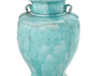 1250
20th century
A Pakistani Glazed Terracotta Jar
With dual handles and all-over blue drip glaze
25" H x 18" Dia.
Estimate: $200 - $400