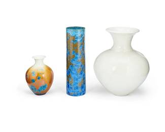 1253
A Group Of Crystalline Glazed Porcelain Vases
Three works:

Phil Morgan (b. 20th century)
A white crystalline glazed vase, 1996
Etched signature to underside: Phil Morgan / 1996
The porcelain vase in globular form with fused flared neck
11.325" H x 9.75" Dia.

Phil Morgan (b. 20th century)
A crystalline glazed vase, 1997
Etched signature to underside: Phil Morgan / 97
The porcelain vase with blue crystalline glazed accents on a buttercream to white gradated ground
6.625" H x 4.75" Dia.

A studio ceramic crystalline glazed vase, Early 21st century
Signed illegibly to underside in felt pen
The cylindrical vase with blue crystalline over a mottled gold and black ground
11.625" H x 3.5" Dia.

3 pieces
Estimate: $200 - $400