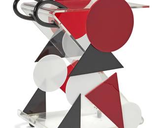 1267
Late 20th century
A Postmodern Acrylic Bar Cart
Appears unmarked
The z-shaped transparent dual shelf cart with applied acrylic accents of circles and tringles in black, white, and red as well as black acrylic handles to one side and casters to the base
35.75" H x 26.75" W x 18" D
Estimate: $200 - $300