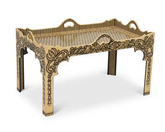 1283
Late 20th century
A Lacquered Coffee Table
Marked to underside: Hand painted by James Alan Smith for Isabel O'Neil / 1993
The hand painted and lacquered particle board table with four handles, the side panels and legs with scrolled acanthus and foliate motifs, the top surface featuring a geometric field centering egg and dart and foliate motif border
24.25" H x 40" W x 24" D
Estimate: $200 - $300