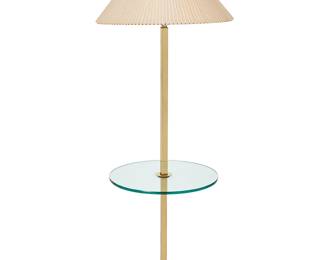1288
Mid-20th century
A Brass And Glass Floor Lamp
The lamp with a squared brass pole on a square base, featuring a round glass tabletop surface and surmounted by a Lucite finial with a mauve, pleated shade
With shade: 61" H x 22" Dia.
Estimate: $300 - $500
