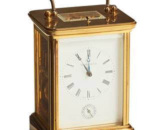 1293
Mid/late 20th century
A Tiffany & Co. Carriage Clock
Marked to front: Tiffany & Co / Swiss Made; etched to back: 11 Eleven Jewels / Unadjusted / Swiss Made / Movement / Matthew Norman / Switzerland / 1751; further marked with a sticker to underside: The Clock Shop
The two-train movement clock with bell alarm, featuring Roman numeral dial above an Arabic numeral sub-second dial, housed in a brass handled case with a beveled glazed door
7" H x 4" W x 3.325" D
Estimate: $300 - $500