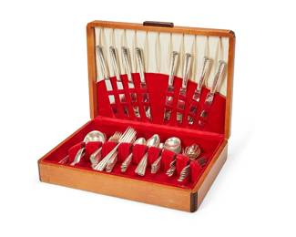 1304
Mid/late 20th century
A Towle "Rambler Rose" Sterling Silver Flatware Service
Each marked: Towle / Sterling / Pat. 1937
Comprising 9 dinner knives (8.75"), 1 master butter spreader (6.875"), 8 butter spreaders (5.875"), 10 dinner forks (7.325"), 9 salad forks (6.75"), 8 bullion soup spoons (6.325"), 14 tea spoons (6"), 1 table spoon (8.325"), 1 sugar spoon (5.75"), 1 gravy ladle (6.625"), 1 ice cream spoon (5.75"), 1 jam/jelly spoon (6.625"), 1 lemon fork (5.5"), and 1 olive fork (6"), housed in a wood case lined with velvet, 66 pieces
Weighable sterling: 62.27 oz. troy approximately
Estimate: $700 - $900