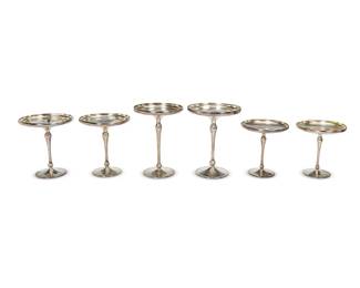 1308
Late 20th century
A Group Of Shreve & Co. Weighted Sterling Silver Compotes
Each marked for sterling silver; each further marked: Shreve & Co. / San Francisco
Comprising six sterling compotes of various sizes, one personalized
Largest: 7.5" H x 5.75" Dia.; smallest: 5.75" H x 5" Dia.
Estimate: $250 - $350