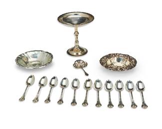 1309
Early/mid-20th century
A Group Of Sterling Silver Table Items
Compote marked for Weidlich Sterling; one plate marked: Shreve & Co. / San Francisco / Sterling / 11013
Comprising a footed compote, two dishes with floral repoussé motifs, a slotted spoon, and a set of teaspoons, 15 pieces

Largest: 6" H x 6" Dia.; smallest spoon: 4.325" L
23.22 oz. troy approximately
Estimate: $400 - $600