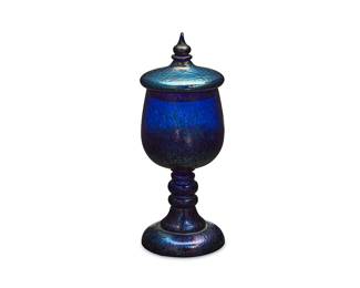 1315
Late 20th century
A Bohemian Iridescent Art Glass Compote
Marked: Czechoslovakia
The lidded oil spot blue glass compote with spire finial
10.75" H x 4" Dia.
Estimate: $300 - $500