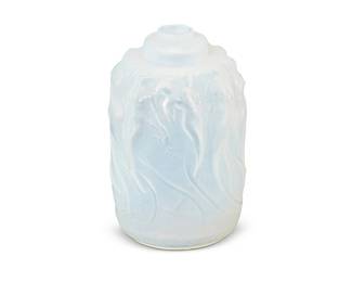 1319
Mid-20th century
A Perfume Diffuser Base After Lalique
Spuriously marked to underside: R. Lalique
The glass perfume diffuser base after the "Calendal" pattern
5.5" H x 3.5" Dia.
Estimate: $200 - $300