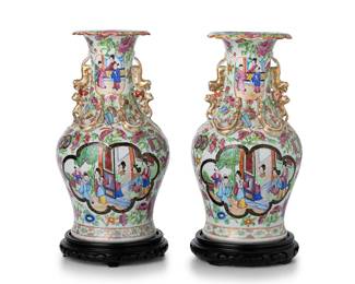 1331
Late Qing Dynasty 1644-1912 or later
A Pair Of Chinese Rose Mandarin Porcelain Vases
Each appears unmarked
Each Famille Rose porcelain vase with a Rose Mandarin pattern, gilt highlights, and polychrome enamel decoration with alternating medallions of figures against a ground of scrolling flowers and haute-relief applied lions, each on a carved wood base, 2 pieces
Each: 14" H x 6.25" Dia.
Estimate: $400 - $600
