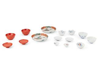 1335
20th century
A Group Of Japanese Porcelain And Lacquerware
Comprising 10 red lacquered wood sake cups with gilt decoration, 10 red lacquered wood sake bowls, 9 porcelain sake cups, 9 porcelain sake bowls, 5 porcelain sake cups with decorative rim, and 9 diminutive porcelain bowls; along with 6 polychrome enameled Imari-style small porcelain plates and 3 wood storage boxes, 62 pieces
Largest: 1.25" H x 6" Dia.; smallest: 0.75" H x 2" Dia.
Estimate: $300 - $500