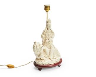 1352
Early 20th century or later
An East Asian Dehua-Style Porcelain Guanyin Lamp
Appears unmarked
The glossy white ceramic figure of the Bodhisattva of Mercy depicted seated upon a guardian lion, retrofitted as a lamp, electrified
19" H x 8" W x 6" D
Estimate: $300 - $500