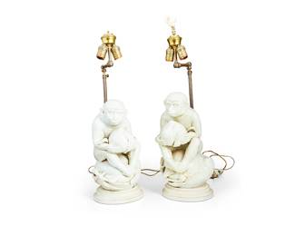 1353
Early 20th century or later
A Pair Of East Asian Dehua-Style Porcelain Monkey Lamps
Each appears unmarked
Each depicting a seated monkey atop a large peach, holding a smaller peach, in the style of Sun Wukong; each retrofitted an a two-light table lamp, electrified
Each: 25" H x 7" W x 10" D
Estimate: $200 - $400