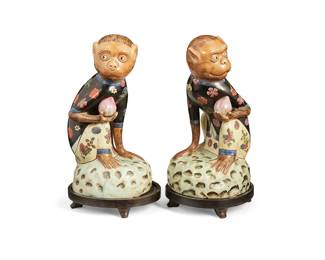 1358
20th century
A Pair Of Chinese Porcelain Monkey Figurines
Each marked to the underside in red enamel bearing an indecipherable apocryphal reign mark
Each depicting a monkey in floral patterned garments perched a rocky plinth and holding a peach; each with accompanying carved wood stand, 4 pieces
Each with stand: 12.5" H x 6" W x 5' D
Estimate: $100 - $150
