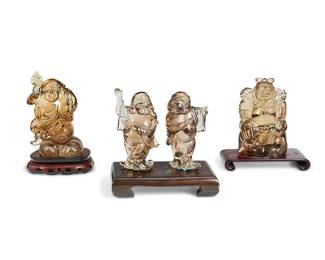 1360
20th century
A Group Of Chinese Carved Stone Figures
The carved smoky quartz figures, each on carved wood stands, comprising four Buddha figures in various poses, two sharing one stand, 4 pieces
Largest with base: 6.325" H x 5.875" W x 3" D; smallest: 5.125" H x 2.625" W x 2" D
Estimate: $500 - $700