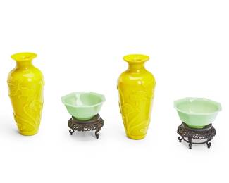 1366
20th century
A Group Of Chinese Peking Glass
Each green bowl with etched mark to the underside: China
Comprising a pair of yellow baluster-form glass vases, each decorated with goldfish and aquatic plants in low relief along with two green octagonal glass bowls, each on a footed carved wood stand, 4 pieces
Larger: 9" H x 4" Dia.; smaller with stand: 4.5" H x 5" Dia.
Estimate: $100 - $150