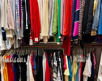 Woman's closet full of St John.  Some Escada, Saks Fifth Ave, Neiman Marcus, Chico's, Ann Taylor.  Sizes S-XL, but most are M and L.