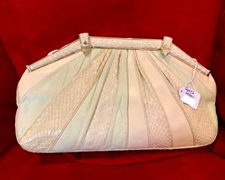 Judith Leiber snakeskin and leather handbag.