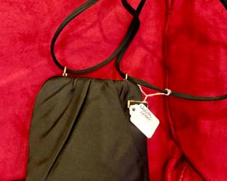 Judith Leiber handbag that opens to the side.