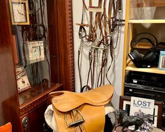 Equestrian English saddle, reins and bits.