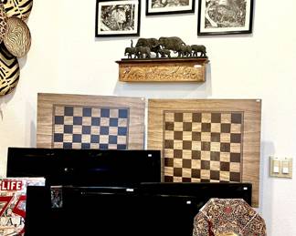 Flat screen TVs, checker tray tables.