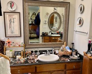 Master bathroom is completely full!  vintage sunglasses.  Erte plates, etc.