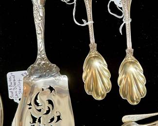 Tiffany & Company “Olympian” sterling spoons.  Reed and Barton, Love Disarmed” sterling server. 