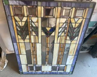 This is the same glass piece-colors changed with the light. This appears to be a Frank Lloyd Wright piece