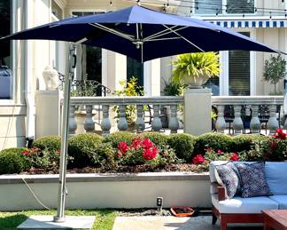 $1200; 8' x 8'; square cantilever umbrella in excellent condtion by Tucci; collapses and expands by easy-lift system with piston assist; compact yet solid with marine-grade aluminum that will resist the wind yet keep you covered (sells new for $3400)