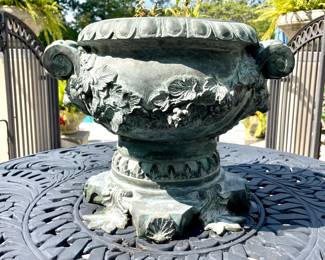 $200; detailed, cast-iron with patina urn