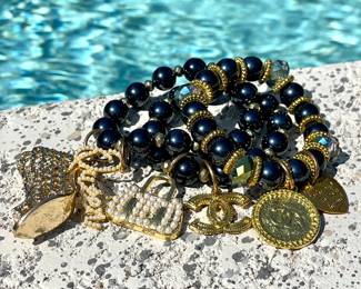 $100; set of 3 faux Chanel beaded bracelets with chic charms