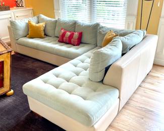 $2400; 78 x 37 x 30 (section 1); 82 x 37 x 30 (section 2); custom-upholstered suede and leather, two-piece Astoria sectional by American Leather Co;                                          $16 each (2 available); pineapple pillow;                                                                                 $24 each (2 available); golden-rod colored, velvet pillow with contrasting piping